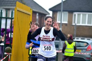 Lliswerry 8 finish and Sara giving the 'ok' hand sign