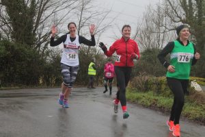 halfway through the Lliswerry 8 - Sara waving at the camera