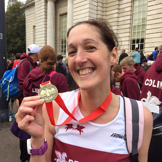 Me and my Cardiff Half Marathon medal